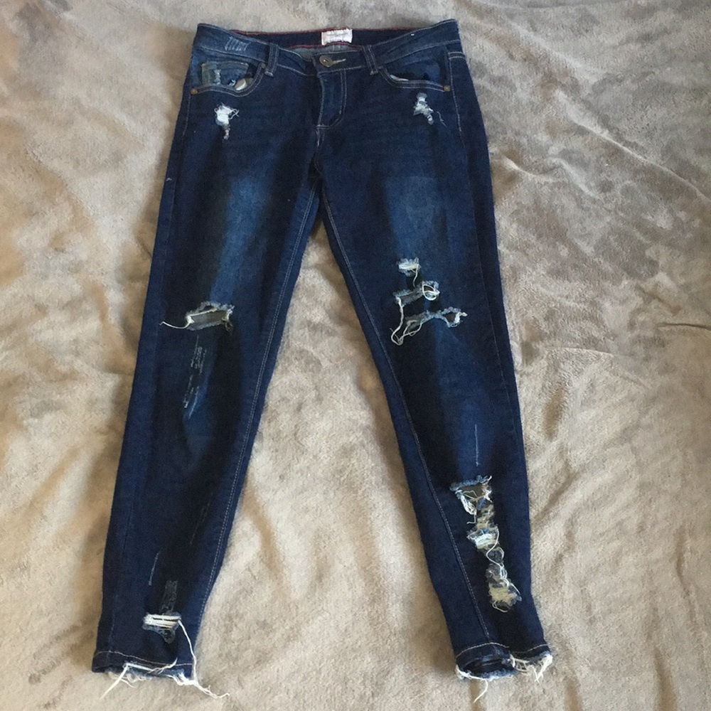 Ripped dark blue jeans